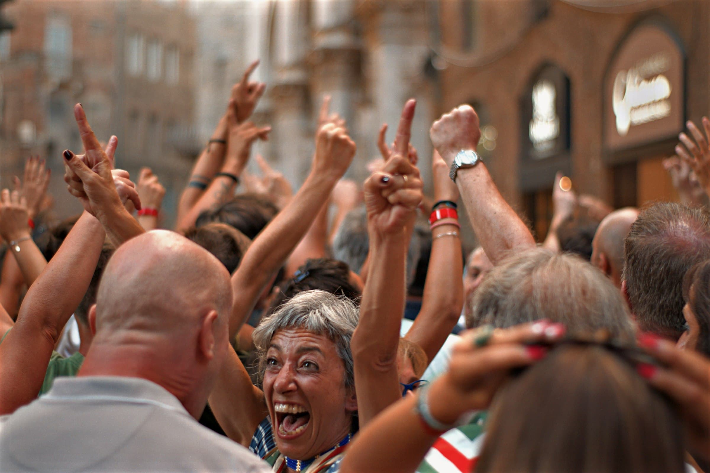 People raising their hands in celebration and togetherness